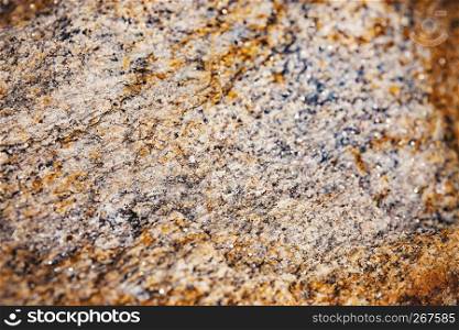 Selected focus at the center of rusty and dusty brown stone surface texture with blurry and vignette border, Abstract grunge nature background.