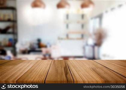 Selected focus empty brown wooden table and Coffee shop blur bac. Selected focus empty brown wooden table and Coffee shop blur background with bokeh image. for your photomontage or product display.