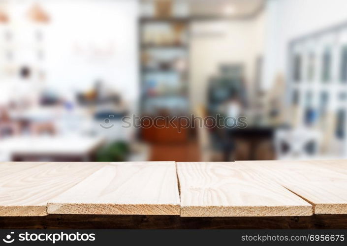 Selected focus empty brown wooden table and Coffee shop or resta. Selected focus empty brown wooden table and Coffee shop or restaurant blur background with bokeh image. for your photomontage or product display