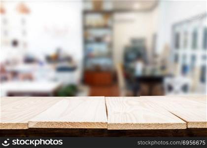 Selected focus empty brown wooden table and Coffee shop or resta. Selected focus empty brown wooden table and Coffee shop or restaurant blur background with bokeh image. for your photomontage or product display