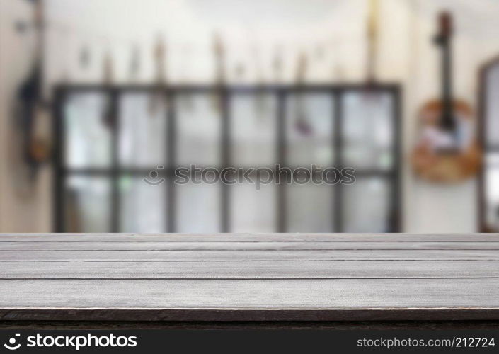 Selected focus empty brown wooden table and Coffee shop or restaurent blur background with bokeh image. for your photomontage or product display