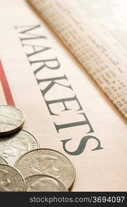 selection of american coins on paper marked Markets