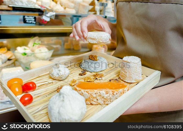 Selection of cheeses on a a wooden board