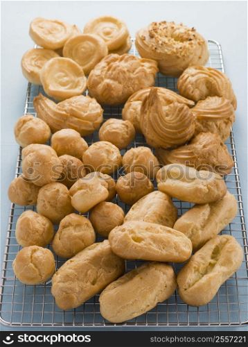Selection of Choux Pastry Buns on a Cooling Rack