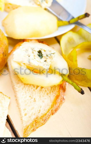 selection of different cheese and fresh pears appetizer snack 