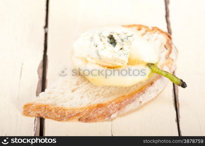 selection of different cheese and fresh pears appetizer snack