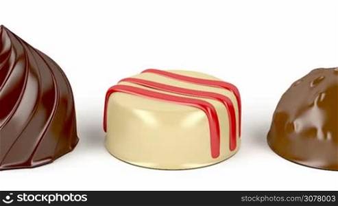 Selection of different chocolate candies on white background