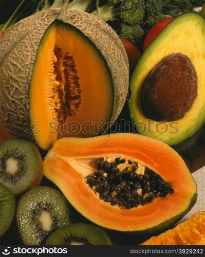 Selection of exotic tropical fruits - cantaloupe, papaya, avacado and Kiwifruit.