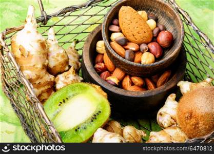 Selection of healthy food. Healthy food concept with with Jerusalem artichoke, kiwi and nuts.Clean eating