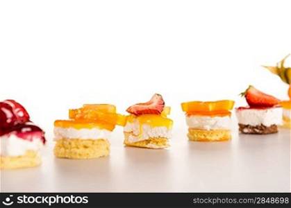 Selection of mini desserts creamy fruit choice sweet tarts petite