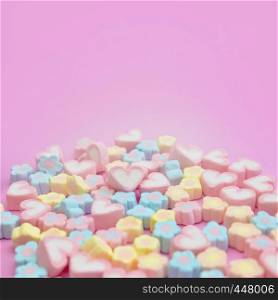 Selective focus a group of pastel sweet colorful candy marshmallows on pink background with copy space for square web banner, brochure, leaflet, flyer, advertisement template or recipe menu design