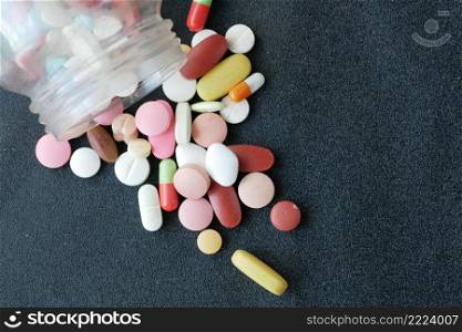 selective focus. Close up of many colorful pills and capsules .. Close up of many colorful pills and capsules on black background 