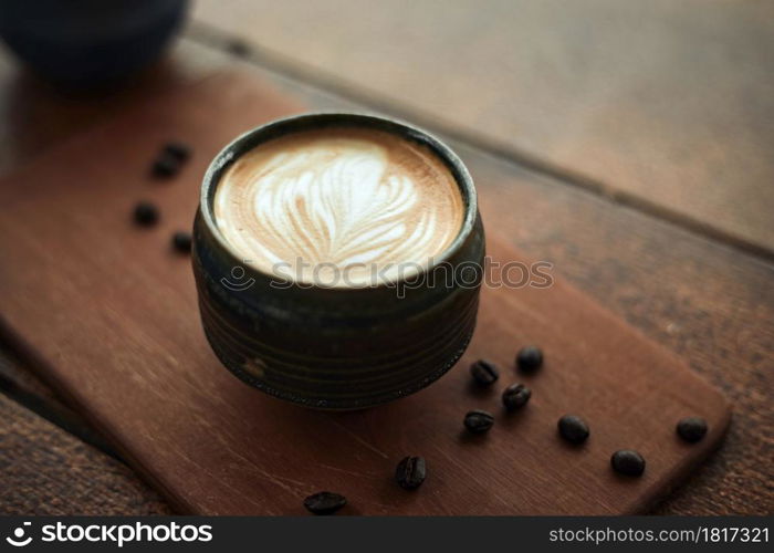 Selective focus cup of hot latte art coffee,focus at white foam. hot latte art coffee