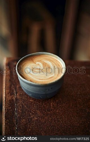 Selective focus cup of hot latte art coffee,focus at white foam. hot latte art coffee