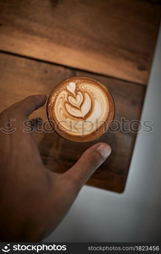 Selective focus cup of hot latte art coffee,focus at white foam. Selective focus cup of hot latte art coffee