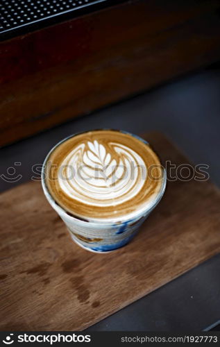 Selective focus cup of hot latte art coffee,focus at white foam. Selective focus cup of hot latte art coffee