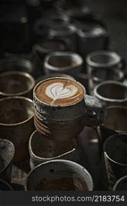 Selective focus cup of hot latte art coffee,focus at white foam . Selective focus cup of hot latte art coffee