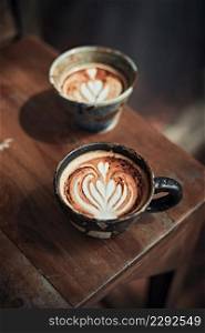 Selective focus cup of hot latte art coffee,focus at white foam. Selective focus cup of hot latte art coffee