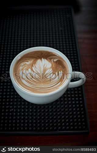 Selective focus cup of hot latte art coffee,focus at white foam
. hot latte art coffee