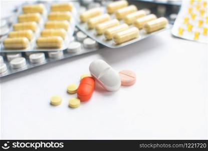 Selective focus of colorful Medical Pills on white background. closeup. Healthcare and medicine. Medical pharmacy concept. Health day. Copyspace. Selective focus of colorful Medical Pills on white background. closeup. Healthcare and medicine. Medical pharmacy concept. Health day