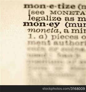 Selective focus of dictionary definition for the word money.