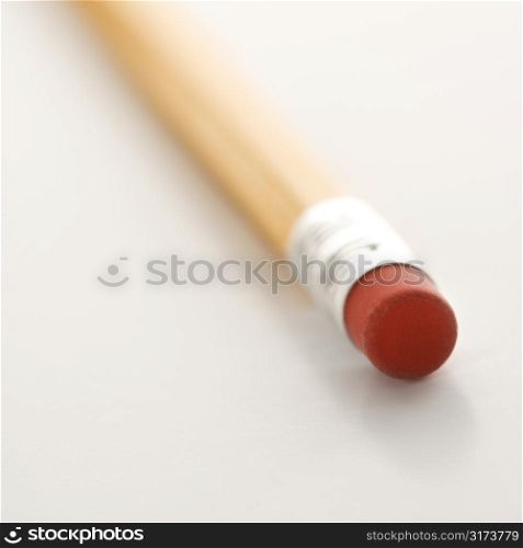 Selective focus of eraser on a pencil.