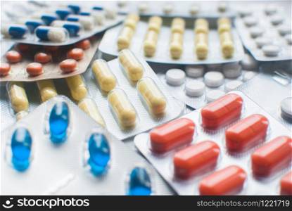 Selective focus of Medical Pills in blisters on blue background. closeup. Healthcare and medicine. Medical pharmacy concept. Health day. Copyspace. Selective focus of Medical Pills in blisters on blue background. closeup. Healthcare and medicine. Medical pharmacy concept. Health day.
