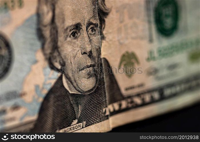 Selective focus on detail of 20 dollars banknote. Close up macro detail of money banknotes, dollars isolated. World money concept, inflation and economy concept