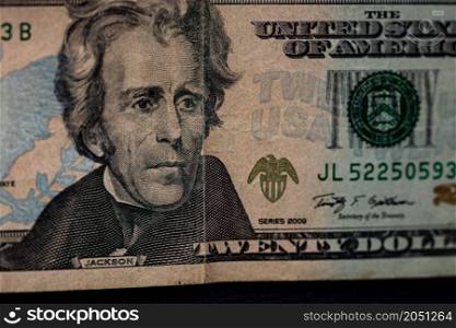 Selective focus on detail of 20 dollars banknote. Close up macro detail of money banknotes, dollars isolated. World money concept, inflation and economy concept