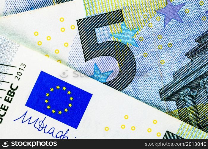 Selective focus on detail of EURO banknotes. Close up macro detail of EURO banknotes. World money concept, inflation and economy concept