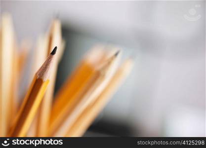 selective focus on nearest parts of some yellow pencil