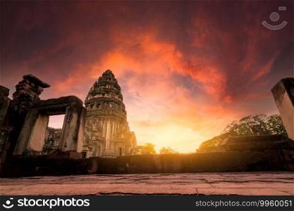Selective focus on Phimai Historical Park with sunset sky. Landmark of Nakhon Ratchasima, Thailand. Travel destinations. Historic site is ancient. Ancient building. Khmer temple classical architecture