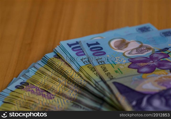 Selective focus on stack of LEI romanian money. Lei banknotes isolated.