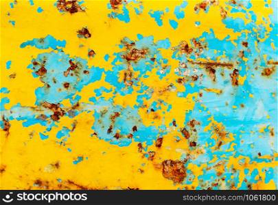 Selective focus rusty metal plate or old metal, Yellow and blue steel metal rust texture for background. Blank copy space