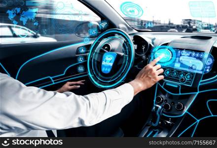 Self-driving autonomous car with relaxed young man sitting at driver seat is driving on busy highway road in the city. Concept of machine learning, artificial intelligence and augmented reality.