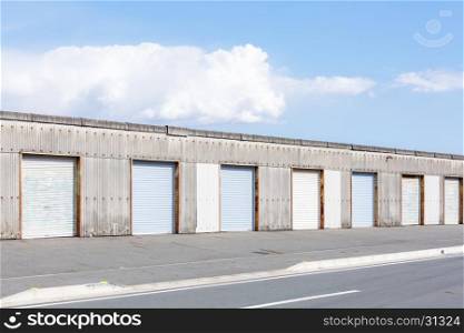 Self Storage Unit Shutter door or roller door of factory building use for industrial background.