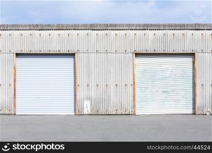 Self Storage Unit Shutter door or roller door of factory building use for industrial background.