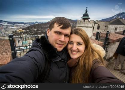 Selfie of happy smiling couple walking on street at Salzburg, Austria