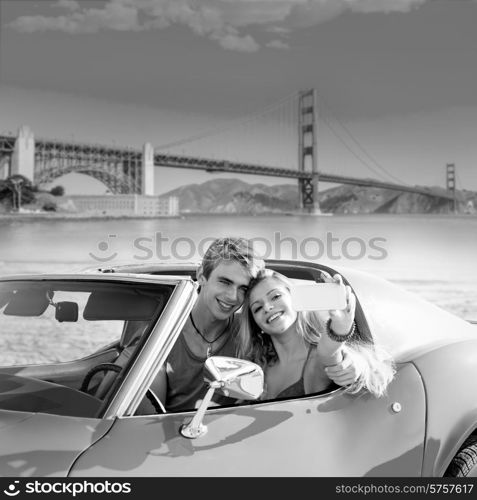 selfie of young teen couple at convertible car in San Francisco Golden Gate Bridge photo mount