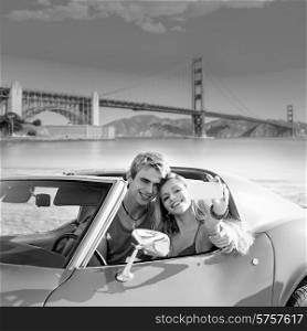 selfie of young teen couple at convertible car in San Francisco Golden Gate Bridge photo mount