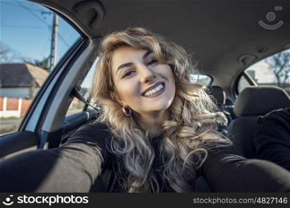 Selfie shoot of beautiful fashion woman in the car