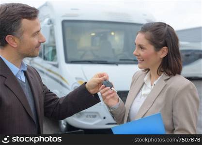seller giving keys to a new owner