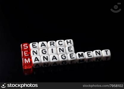 SEM Search Engine Management written on dices on black