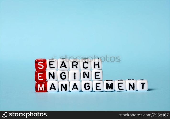 SEM Search Engine Management written on dices on blue