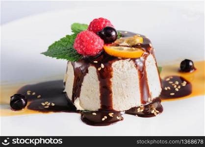 semifredo, italian ice cream dessert with halva, raspberry and chocolate sauce on top. semifredo, italian ice cream dessert with halva