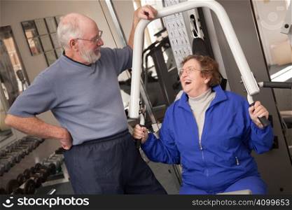 Senior Adult Couple Working Out in the Gym.