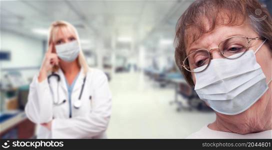 Senior Adult Female Looking Down as Doctor Stands Behind All Wearing Medical Face Masks Within Hospital.