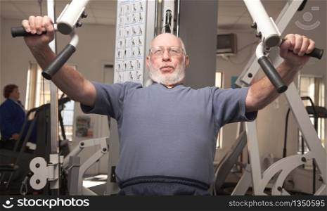 Senior Adult Man Working Out in the Gym.