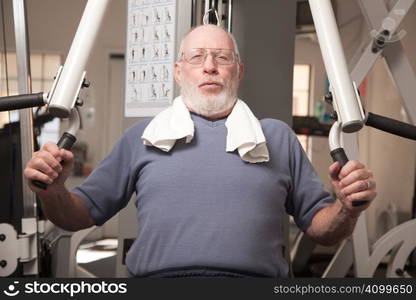 Senior Adult Man Working Out in the Gym.