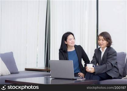 senior and junior businesswoman discuss something during their meeting.
